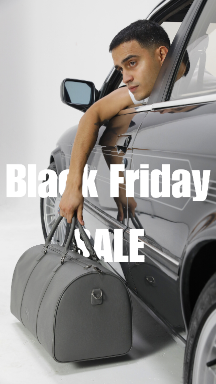 Person leaning out of a car with a gray duffel bag, 'Black Friday Sale' text overlay.